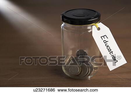 Coins in a jam jar View Large Photo Image Stock Photograph - Coins in a jam jar. Fotosearch