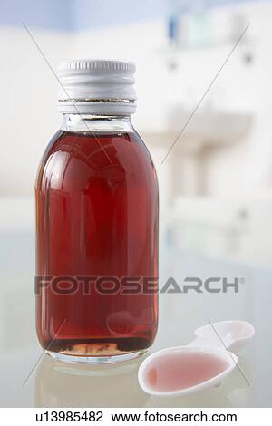Cough medicine on bathroom shelf View Large Photo Image Stock Image - Cough medicine on bathroom shelf. Fotosearch