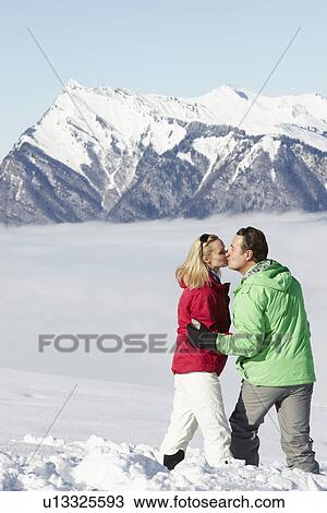 Couple Admiring Mountain View Whilst On Ski Holiday In Mountains View Large Photo Image Stock Image - Couple Admiring Mountain View Whilst On Ski Holiday In Mountains. Fotosearch