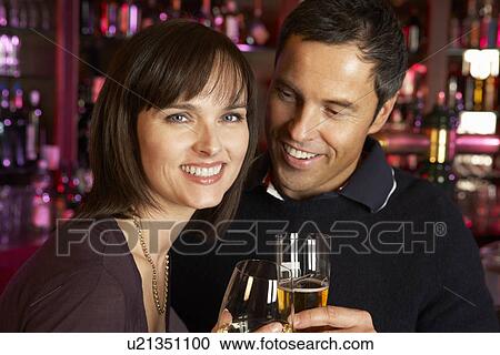 Couple Enjoying Drink Together In Bar View Large Photo Image Stock Image - Couple Enjoying Drink Together In Bar. Fotosearch