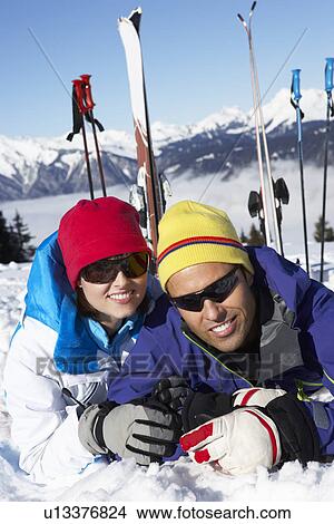 Couple Having Fun On Ski Holiday In Mountains View Large Photo Image Picture - Couple Having Fun On Ski Holiday In Mountains. Fotosearch