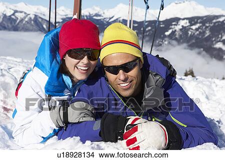 Picture - Couple Having Fun On Ski Holiday In Mountains. Fotosearch