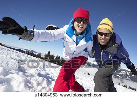 Couple Having Fun On Ski Holiday In Mountains View Large Photo Image Stock Image - Couple Having Fun On Ski Holiday In Mountains. Fotosearch