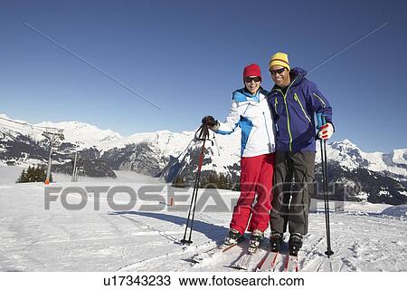 Couple Having Fun On Ski Holiday In Mountains View Large Photo Image Stock Image - Couple Having Fun On Ski Holiday In Mountains. Fotosearch