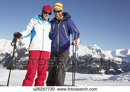 Couple Having Fun On Ski Holiday In Mountains View Large Photo Image Stock Image - Couple Having Fun On Ski Holiday In Mountains. Fotosearch