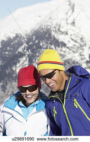 Couple Having Fun On Ski Holiday In Mountains View Large Photo Image Stock Image - Couple Having Fun On Ski Holiday In Mountains. Fotosearch