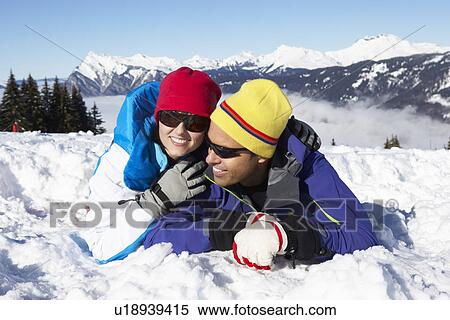 Stock Photography - Couple Having Fun On Ski Holiday In Mountains. Fotosearch