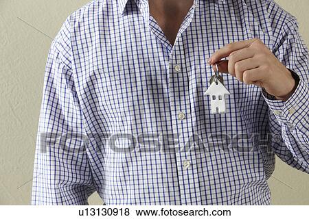 Cropped Shot Of Man Holding Keys To First Home View Large Photo Image Stock Photo - Cropped Shot Of Man Holding Keys To First Home. Fotosearch