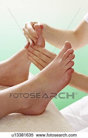 Stock Photography - Detail woman having foot massage. Fotosearch
