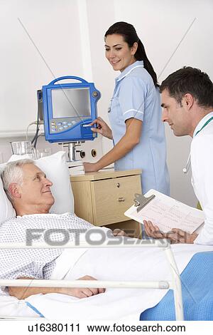 Stock Image - Doctor, nurse and patient in USA Accident and Emergency. Fotosearch