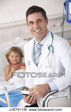 Doctor with child patient in USA Accident and Emergency View Large Photo Image Stock Photo - Doctor with child patient in USA Accident and Emergency. Fotosearch