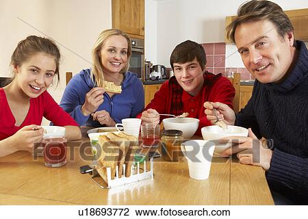 Family Eating Breakfast Together In Kitchen View Large Photo Image Stock Image - Family Eating Breakfast Together In Kitchen. Fotosearch