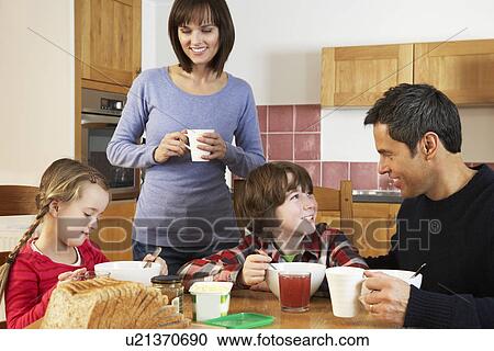 Family Eating Breakfast Together In Kitchen View Large Photo Image Stock Image - Family Eating Breakfast Together In Kitchen. Fotosearch
