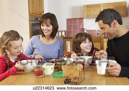 Family Eating Breakfast Together In Kitchen View Large Photo Image Stock Image - Family Eating Breakfast Together In Kitchen. Fotosearch