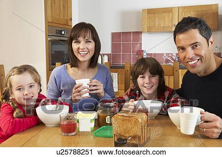Family Eating Breakfast Together In Kitchen View Large Photo Image Stock Image - Family Eating Breakfast Together In Kitchen. Fotosearch