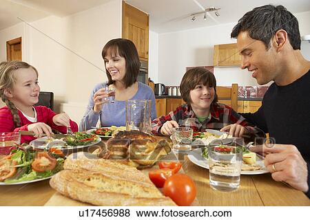 Family Eating Lunch Together In Kitchen View Large Photo Image Stock Photo - Family Eating Lunch Together In Kitchen. Fotosearch