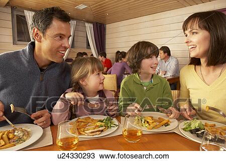 Family Eating Lunch Together In Restaurant View Large Photo Image Stock Image - Family Eating Lunch Together In Restaurant. Fotosearch