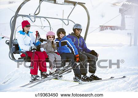 Family Getting Off chair Lift On Ski Holiday In Mountains View Large Photo Image Stock Image - Family Getting Off chair Lift On Ski Holiday In Mountains. Fotosearch