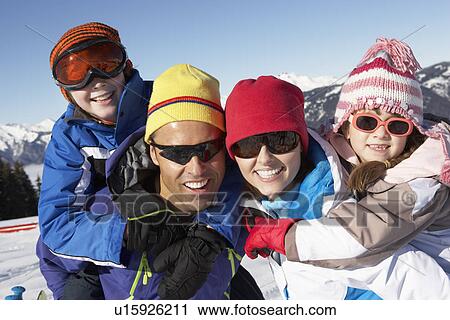 Family Having Fun On Ski Holiday In Mountains View Large Photo Image Stock Image - Family Having Fun On Ski Holiday In Mountains. Fotosearch