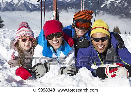 Family Having Fun On Ski Holiday In Mountains View Large Photo Image Stock Photo - Family Having Fun On Ski Holiday In Mountains. Fotosearch