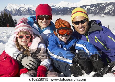 Family Having Fun On Ski Holiday In Mountains View Large Photo Image Stock Photography - Family Having Fun On Ski Holiday In Mountains. Fotosearch