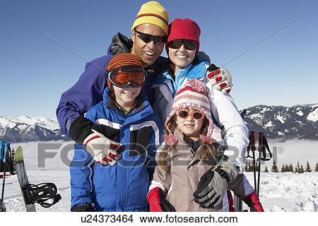 Picture - Family On Ski Holiday In Mountains. Fotosearch