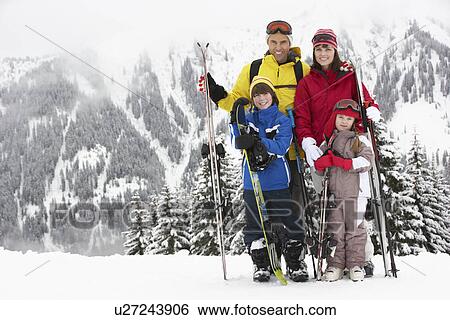 Stock Photograph - Family On Ski Holiday In Mountains. Fotosearch