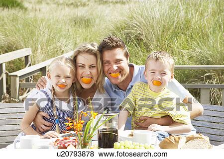 Family on vacation eating outdoors View Large Photo Image Stock Photo - Family on vacation eating outdoors. Fotosearch