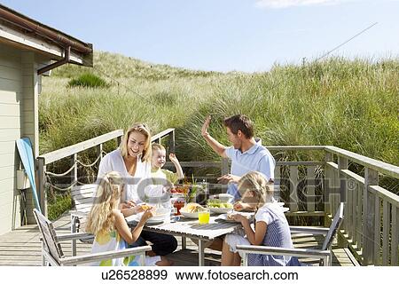 Family on vacation eating outdoors View Large Photo Image Stock Photo - Family on vacation eating outdoors. Fotosearch