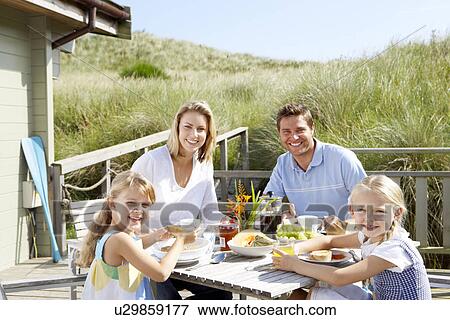 Family on vacation eating outdoors View Large Photo Image Stock Photo - Family on vacation eating outdoors. Fotosearch