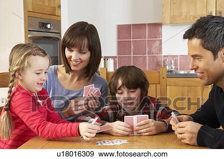 Family Playing Cards In Kitchen View Large Photo Image Stock Photo - Family Playing Cards In Kitchen. Fotosearch