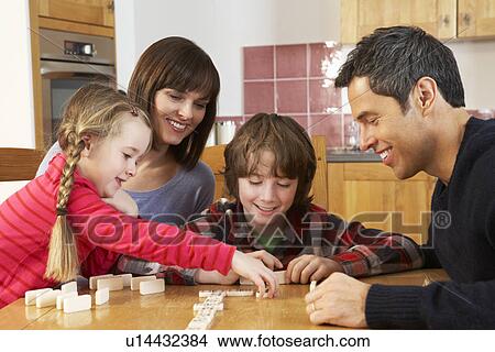 Family Playing Dominoes In Kitchen View Large Photo Image Picture - Family Playing Dominoes In Kitchen. Fotosearch