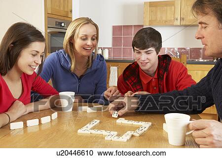 Family Playing Dominoes In Kitchen View Large Photo Image Stock Image - Family Playing Dominoes In Kitchen. Fotosearch
