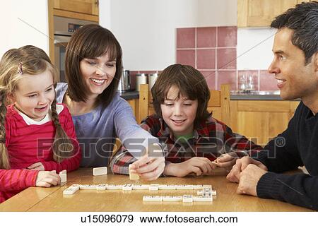 Family Playing Dominoes In Kitchen View Large Photo Image Stock Photo - Family Playing Dominoes In Kitchen. Fotosearch