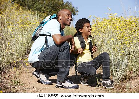 Father and son on country hike View Large Photo Image Stock Photo - Father and son on country hike. Fotosearch