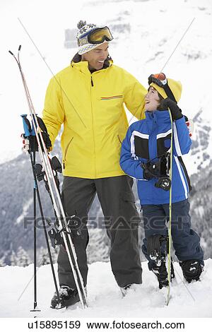 Father And Son On Ski Holiday In Mountains View Large Photo Image Stock Photo - Father And Son On Ski Holiday In Mountains. Fotosearch