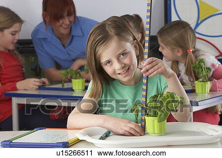 Girl learning about plants in school class View Large Photo Image Stock Image - Girl learning about plants in school class. Fotosearch