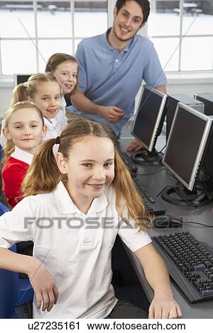 Girls and teacher in school class View Large Photo Image Stock Image - Girls and teacher in school class. Fotosearch