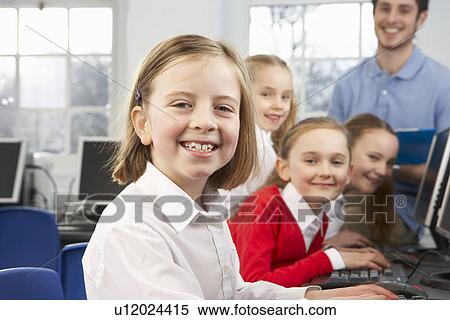 Girls and teacher in school class View Large Photo Image Stock Photography - Girls and teacher in school class. Fotosearch