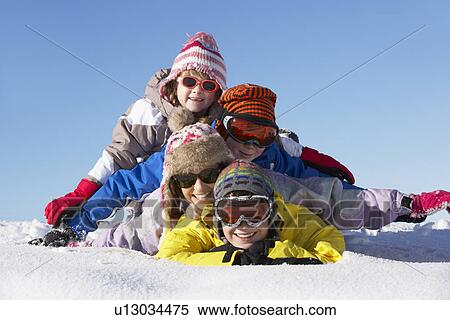 Stock Photography - Group Of Children Having Fun On Ski Holiday In Mountains. Fotosearch