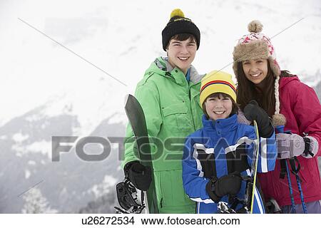 Group Of Children On Ski Holiday In Mountains View Large Photo Image Picture - Group Of Children On Ski Holiday In Mountains. Fotosearch