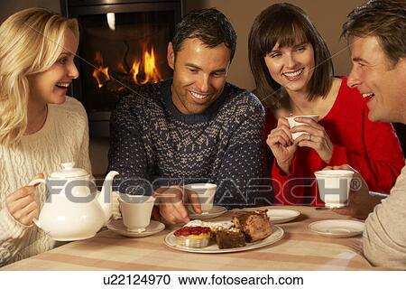Group Of Middle Aged Couples Enjoying Tea And Cake Together View Large Photo Image Stock Image - Group Of Middle Aged Couples Enjoying Tea And Cake Together. Fotosearch