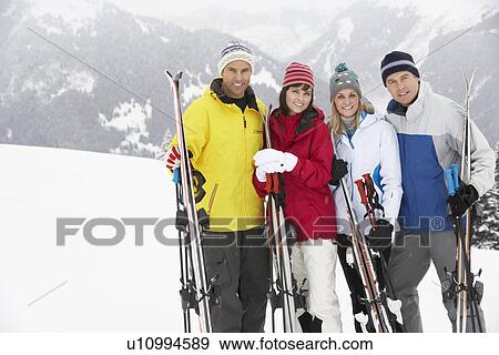 Group Of Middle Aged Couples On Ski Holiday In Mountains View Large Photo Image Stock Photo - Group Of Middle Aged Couples On Ski Holiday In Mountains. Fotosearch