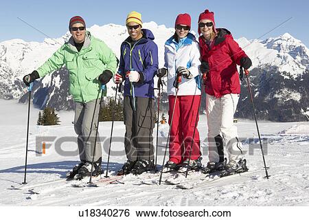 Group Of Middle Aged Couples On Ski Holiday In Mountains View Large Photo Image Stock Photograph - Group Of Middle Aged Couples On Ski Holiday In Mountains. Fotosearch
