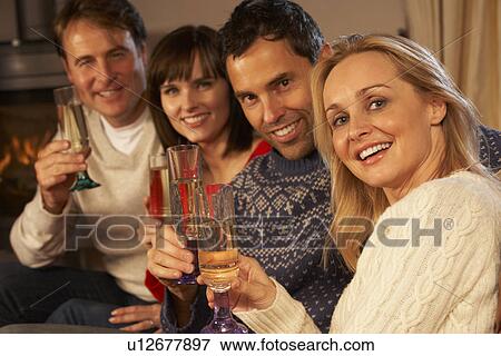 Group Of Middle Aged Couples Sitting On Sofa With Champagne View Large Photo Image Stock Photo - Group Of Middle Aged Couples Sitting On Sofa With Champagne. Fotosearch