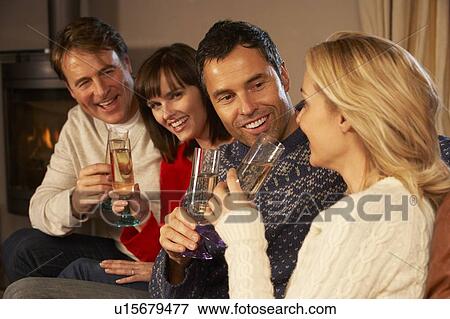 Group Of Middle Aged Couples Sitting On Sofa With Champagne View Large Photo Image Stock Photo - Group Of Middle Aged Couples Sitting On Sofa With Champagne. Fotosearch