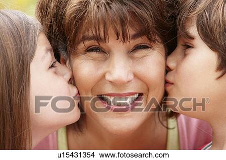 Picture - Hispanic grandmother and grandchildren. Fotosearch
