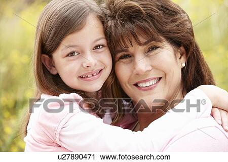 Stock Image - Hispanic grandmother and granddaughter. Fotosearch