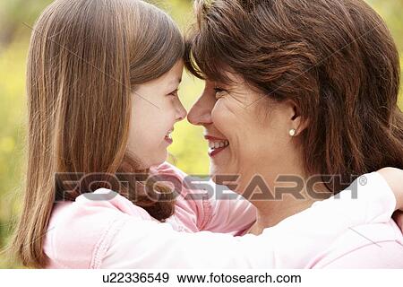 Stock Photo - Hispanic grandmother and granddaughter. Fotosearch