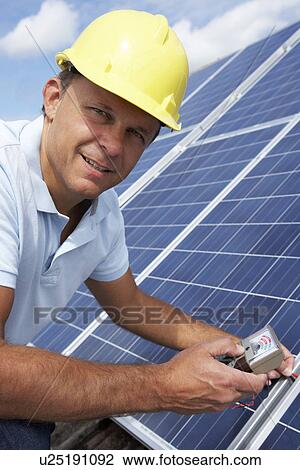 Man installing solar panels View Large Photo Image Stock Image - Man installing solar panels. Fotosearch
